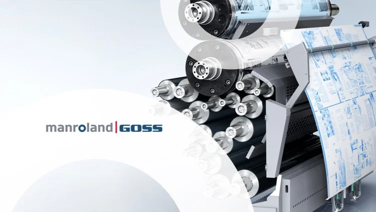 Industrial web offset printing production line inside commercial printing facility.